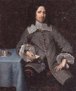 unknow artist Portrait of a gentleman,three-quarter length,standing beside a table oil painting on canvas